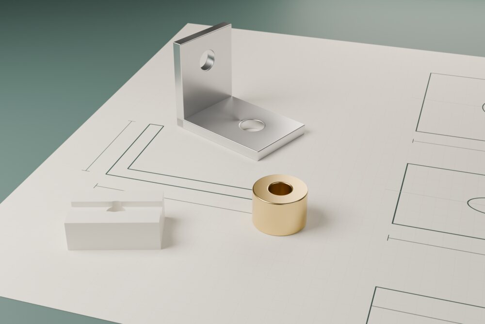 図面の上に置いた金属部品のイメージ